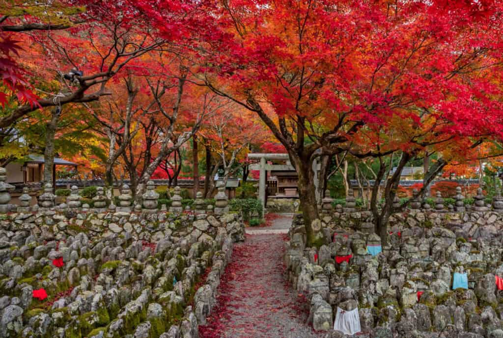 Rows of stone statues at the Adashino Nenbutsuji Temple in Arashiyama, Kyoto, Japan