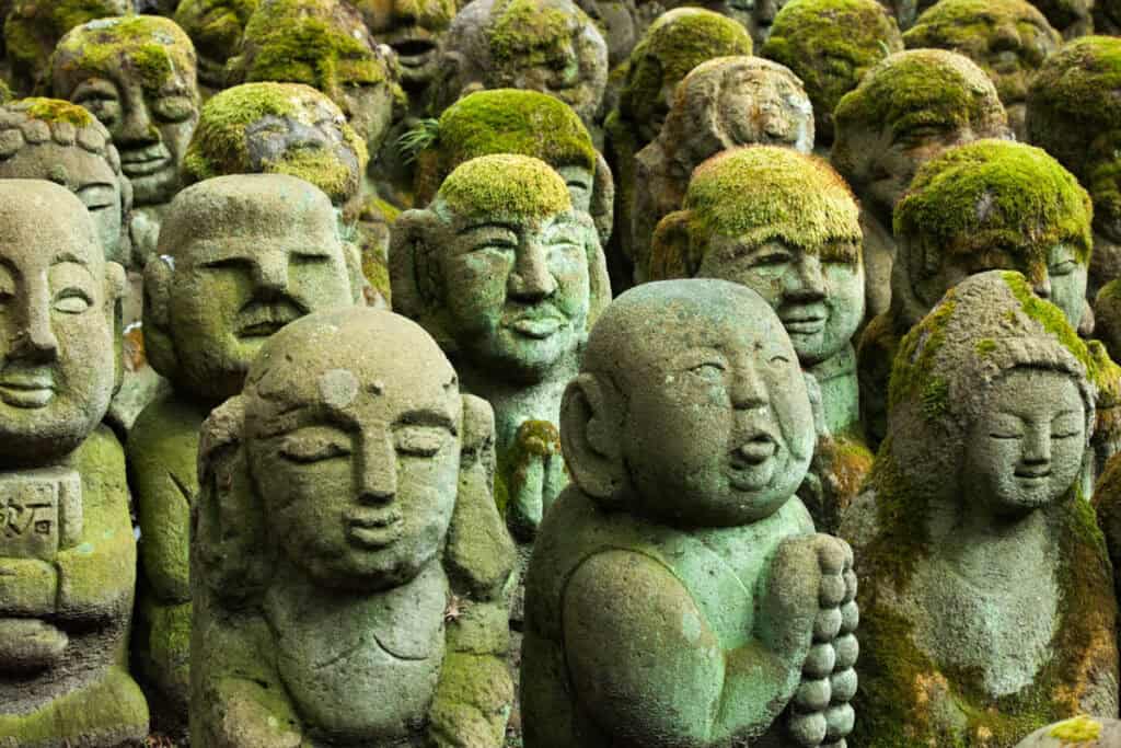 Rakan statues carved by visitors at the Otagi Nenbutsuji Temple in Arashiyama, Kyoto, Japan